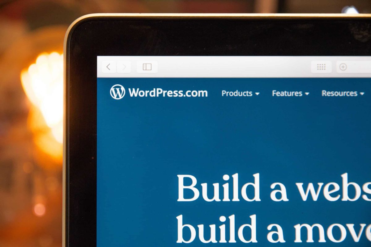 corner of laptop showing wordpress.com