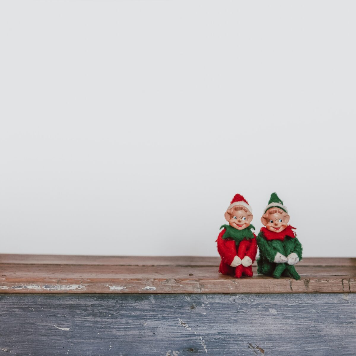 Two Elf on the Shelf Figurines on a Holiday Table