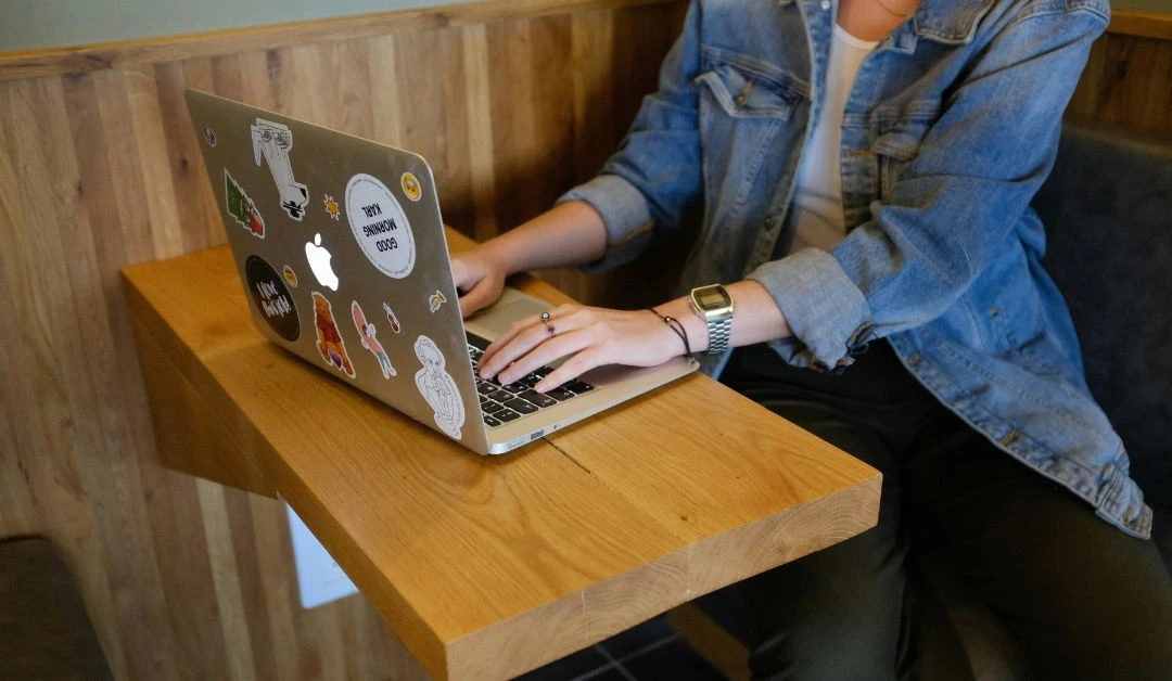 Nashville small business owner designing a website using AI tools from a cozy, creative workspace.