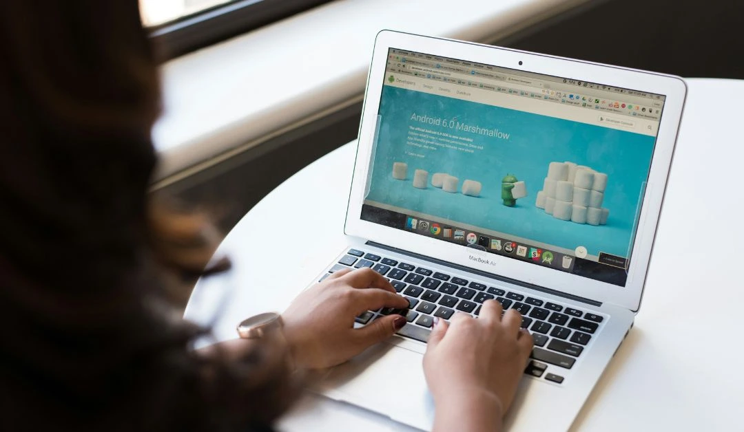 Designer at a modern Nashville studio crafting a visually engaging website using AI-powered tools.