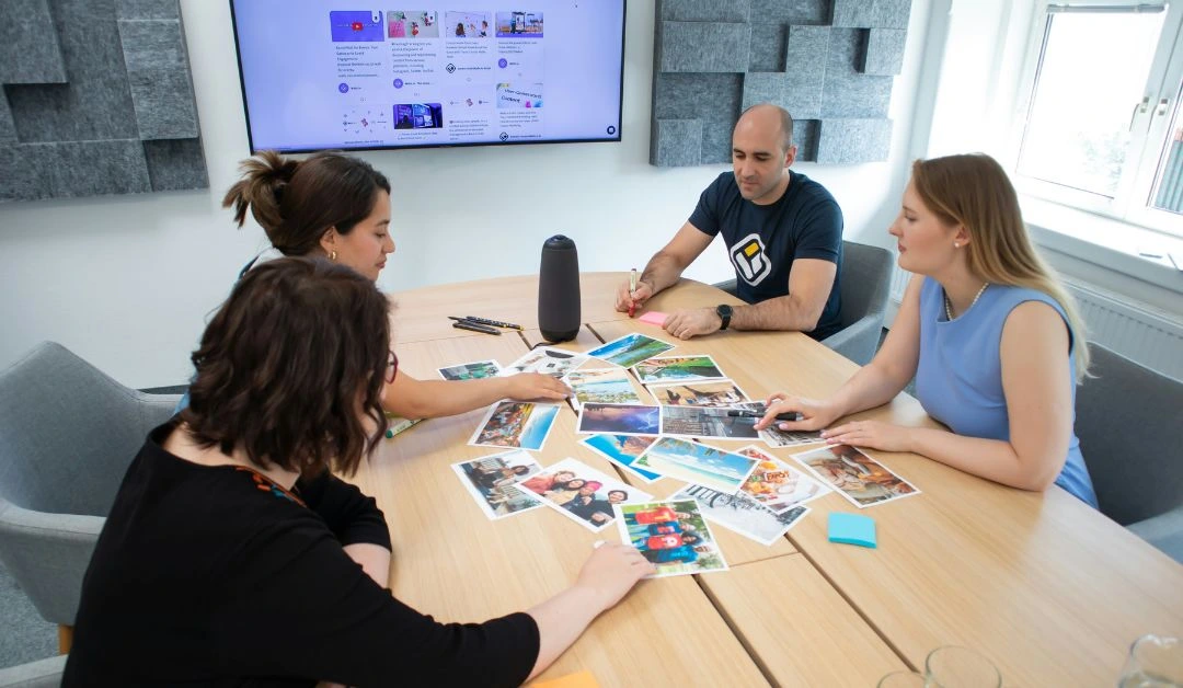 A Nashville small business owner discussing a project with a local web development agency using AI tools for website planning.