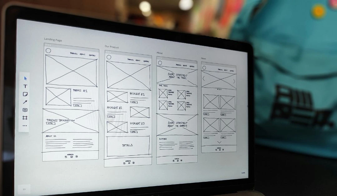 Computer screen displaying wireframes for a website