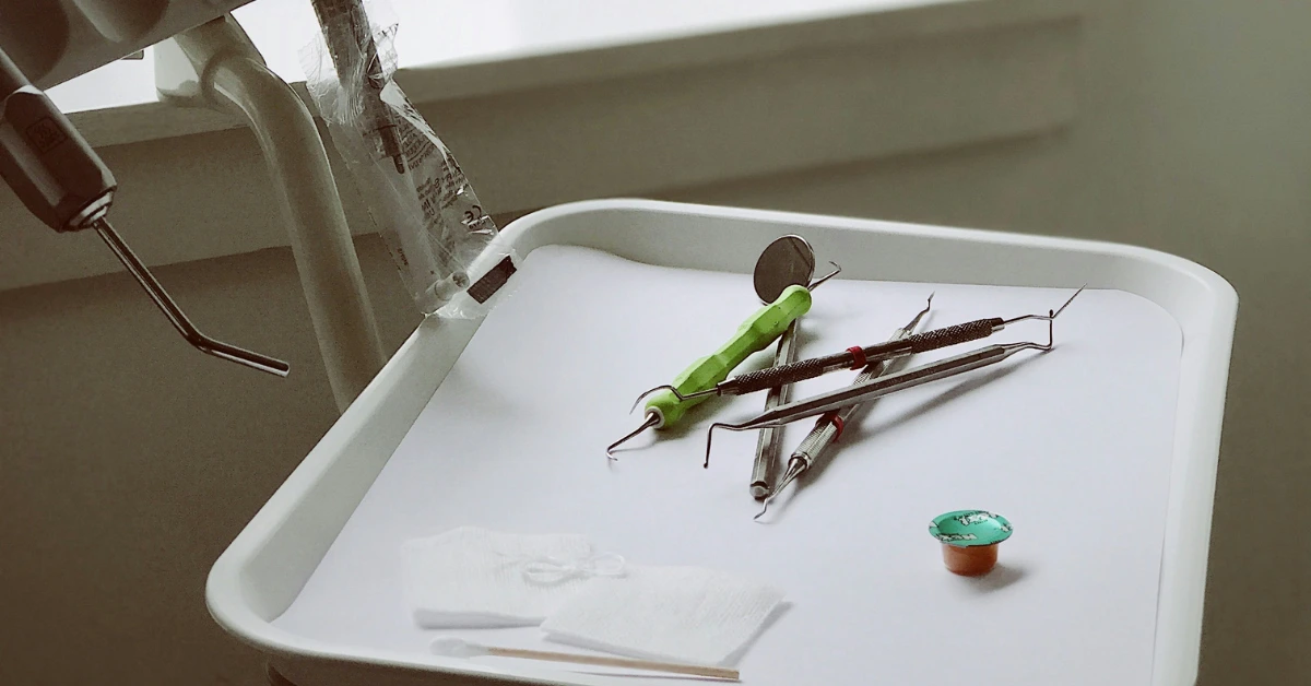 Dental tools on a tray near a window in a clean, modern dental office in Nashville.